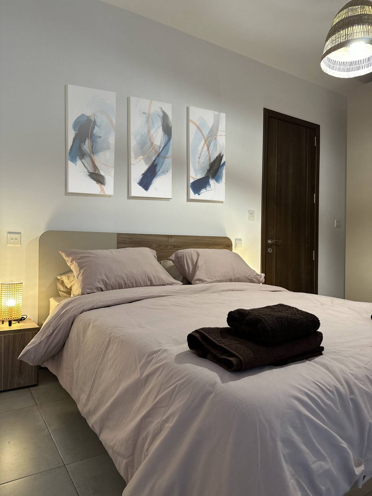 Bedroom prepared with fresh linen and towels at the Blue Moon apartment in Marsaxlokk
