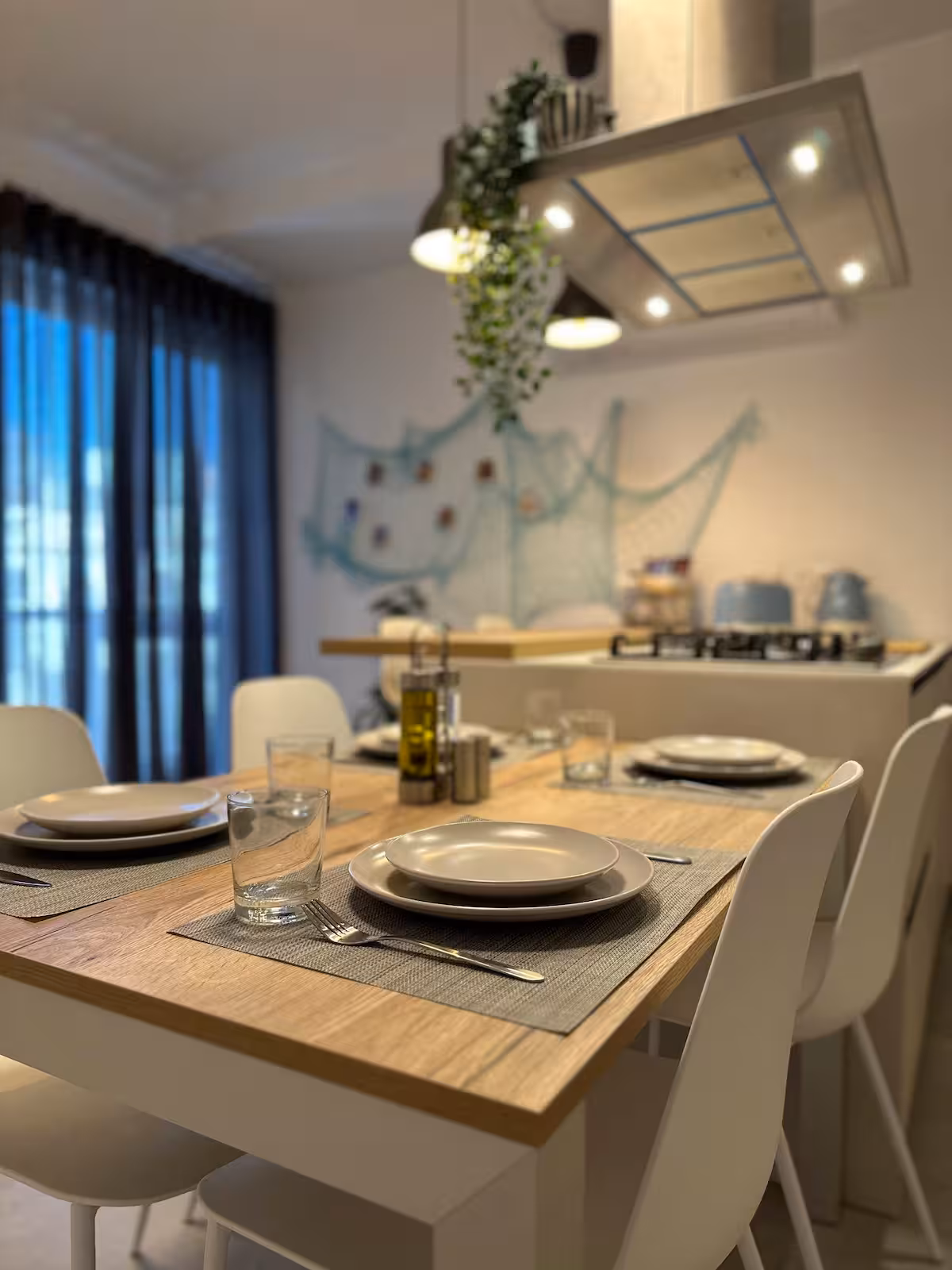 Dining table set for guests at the Blue Moon apartment in Marsaxlokk